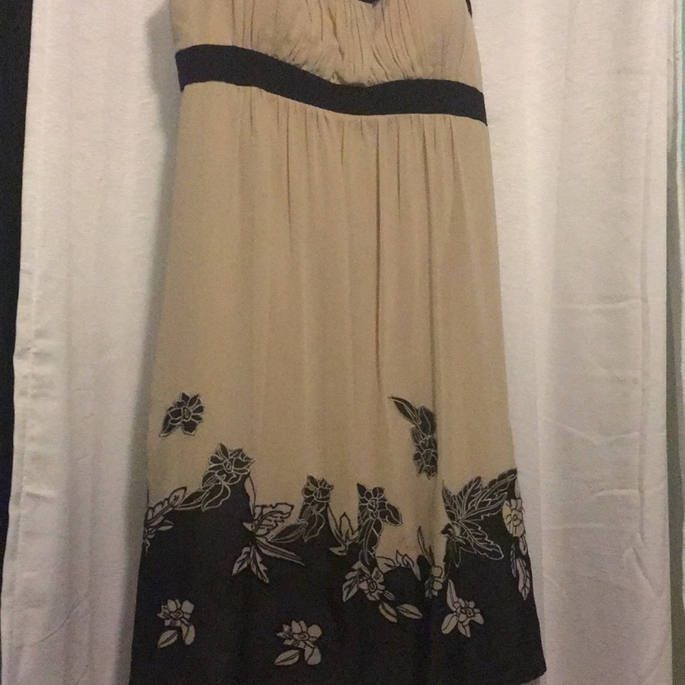 Cream colored dress with black floral detailing